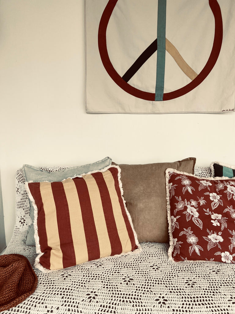 med stripe cushion | rust + teal